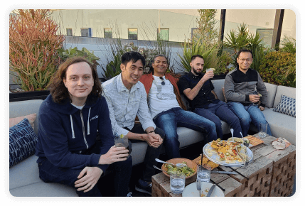 five men on an outdoor couch